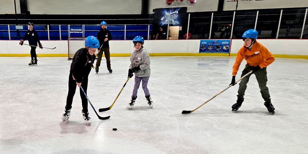 Kids preparing for a hockey game